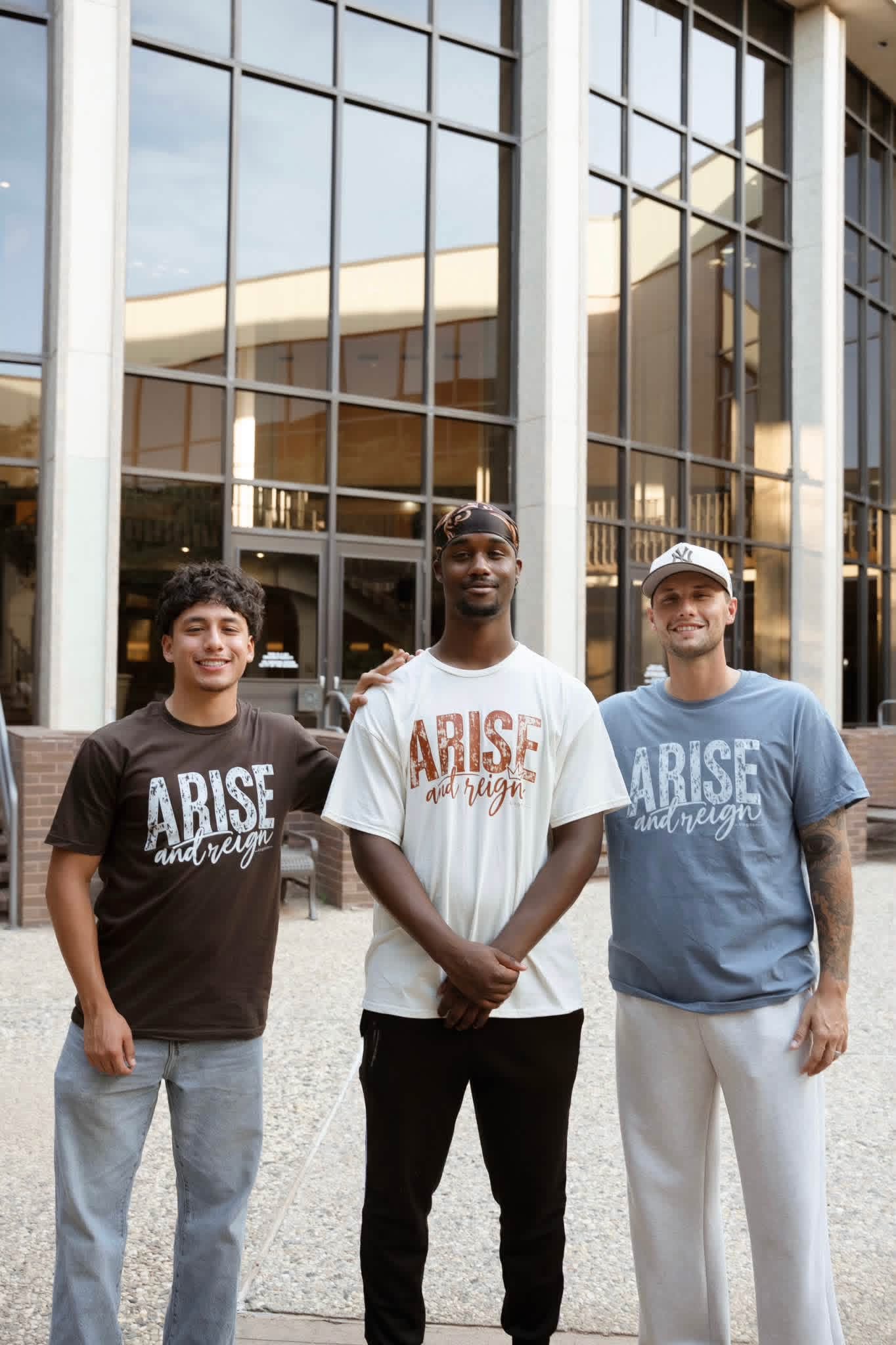 A member wearing the Arise and Reign t-shirt